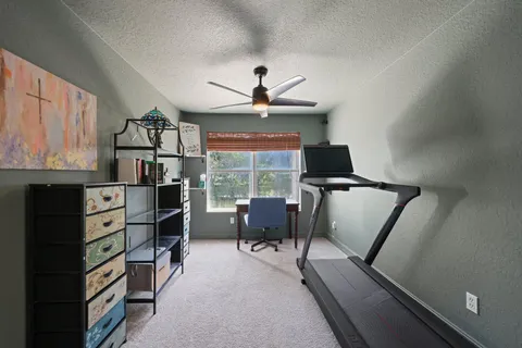 a bathroom with a sink vanity granite tub shower and a mirror