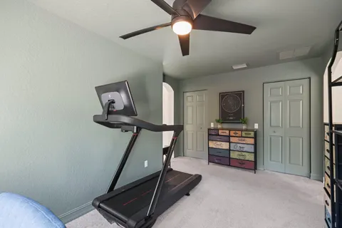 a hallway with a couch and a stove top oven