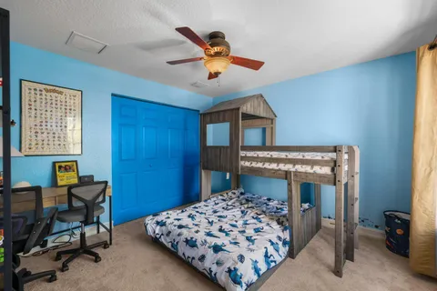 a view of a house with a yard and plants