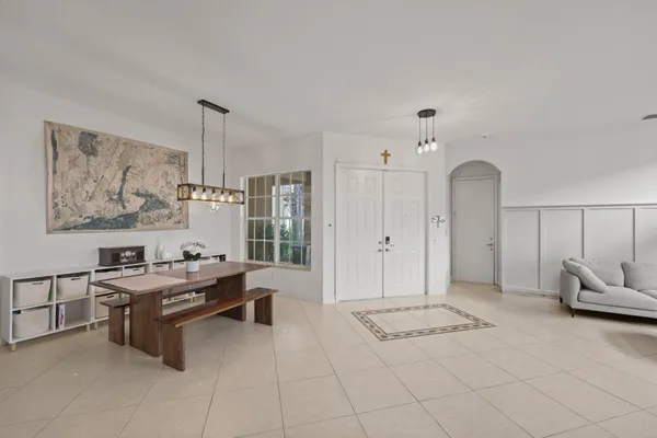 a room with furniture a air conditioner and a window