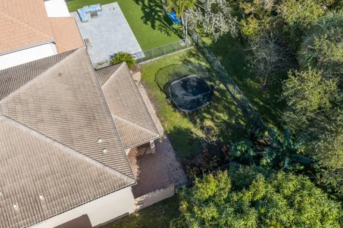 a view of a porch with a table and chairs