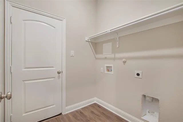 a kitchen with kitchen island granite countertop a sink cabinets and stainless steel appliances