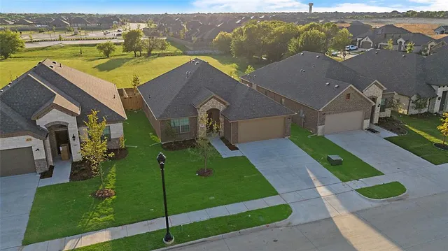 an empty room with a chandelier fan