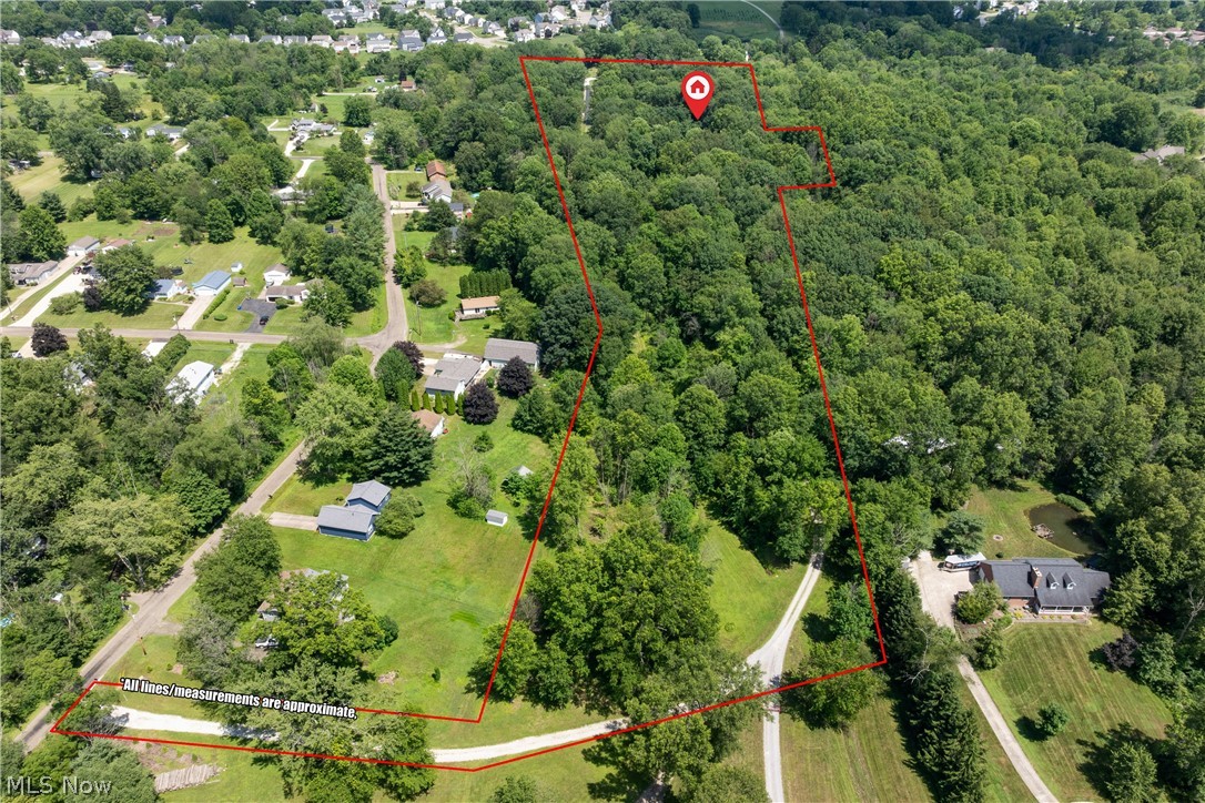 10400 Stoneacre Road Northwest Canal Fulton, OH 44614 - Photo 41 of 44 Aerial overview of property's location with property boundaries highlighted and a forest
