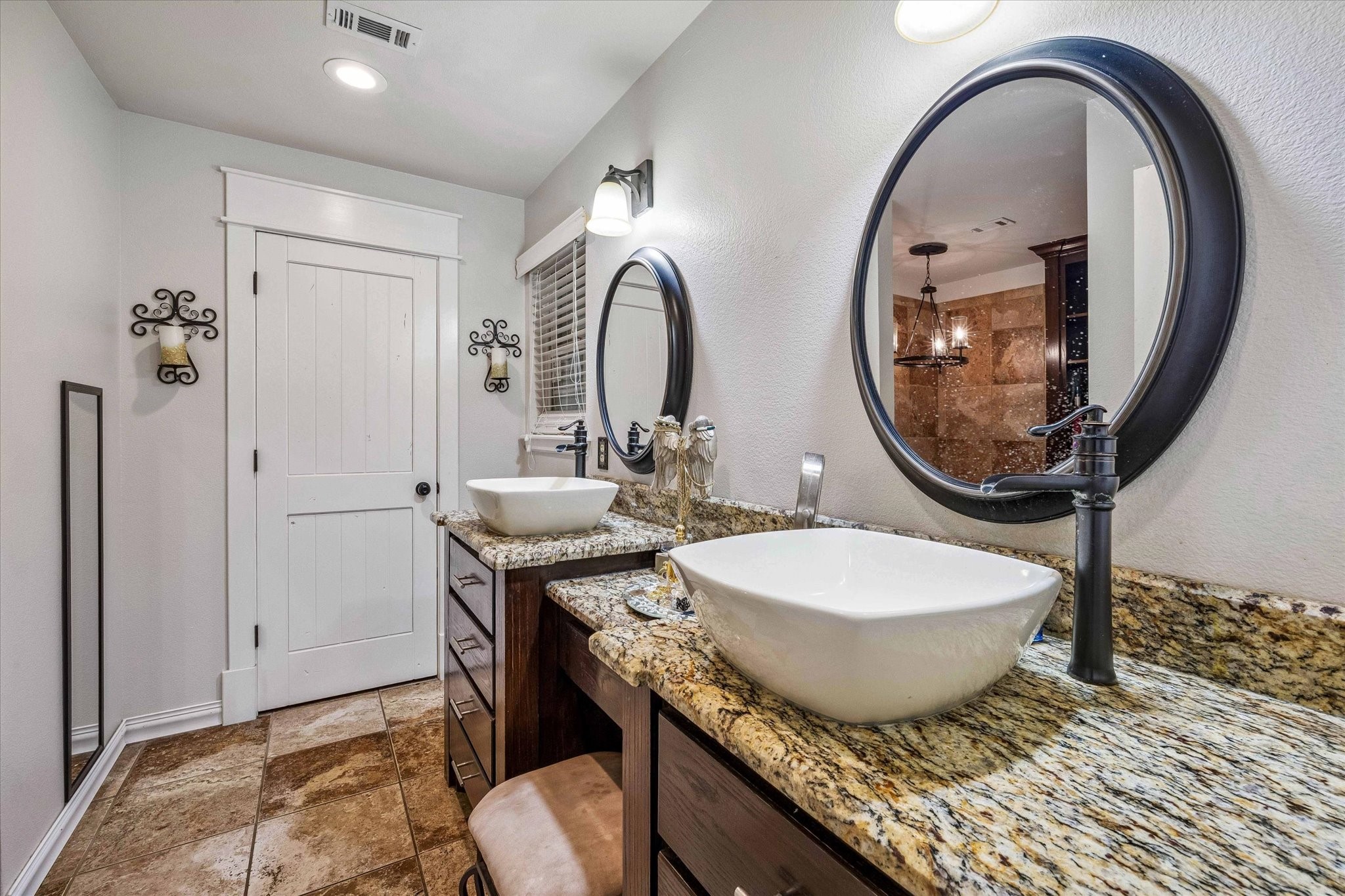 3515 County Road 36 Angleton, TX 77515 - Photo 24 of 50 a bathroom with a granite countertop toilet a sink and a mirror