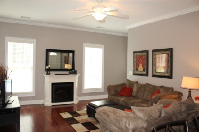 635 Klopfer Road Juliette, GA 31046 - Photo 12 of 18 a living room with furniture a fireplace and a flat screen tv
