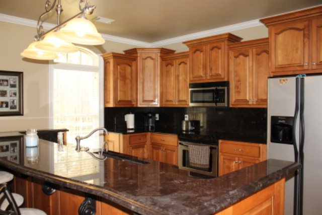 635 Klopfer Road Juliette, GA 31046 - Photo 6 of 18 a kitchen with granite countertop a stove a sink and a microwave
