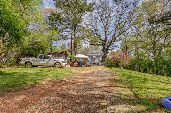 a house with a trees in front of it