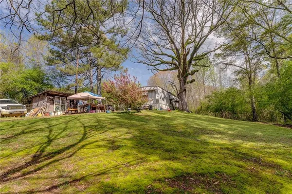 a backyard of a house with lots of green space