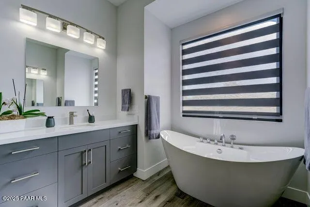 a bathroom with a double vanity sink and mirror
