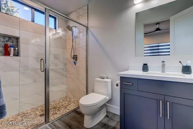 a bedroom with two beds and a lamp