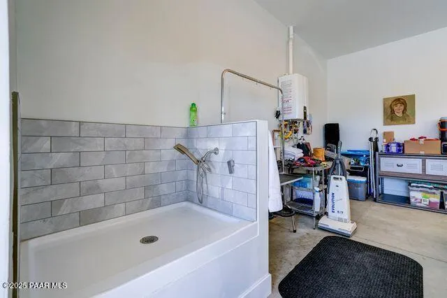 a view of a livingroom with furniture and a bookshelf
