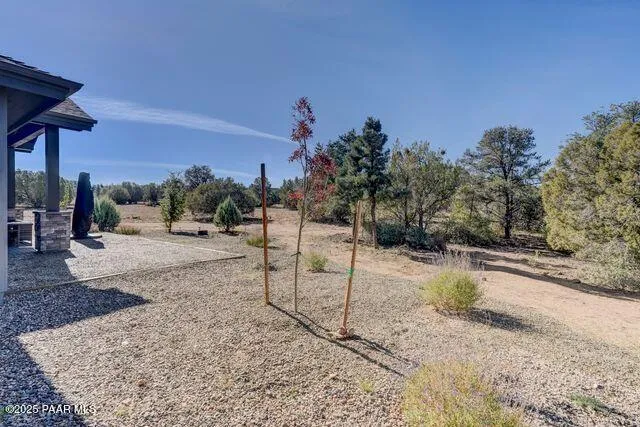 a view of a terrace with a table and chairs