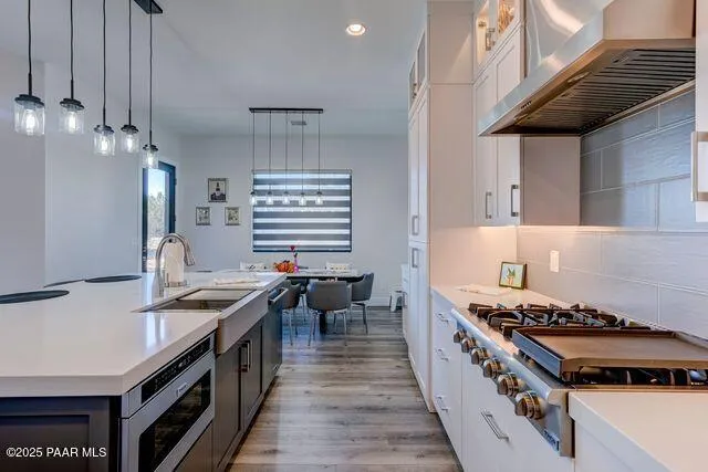 a kitchen with a stove and a sink