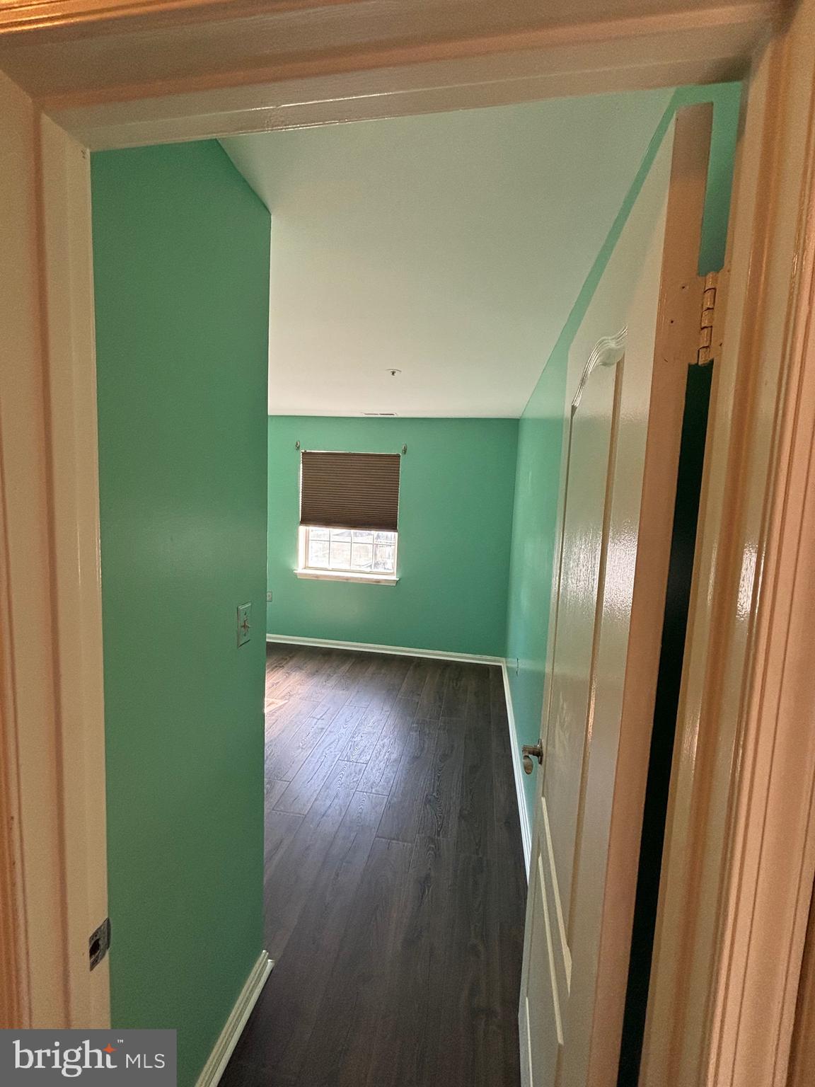 8513 Falls Run Road, Unit A Ellicott City, MD 21043 - Photo 20 of 39 a view of empty room with wooden floor