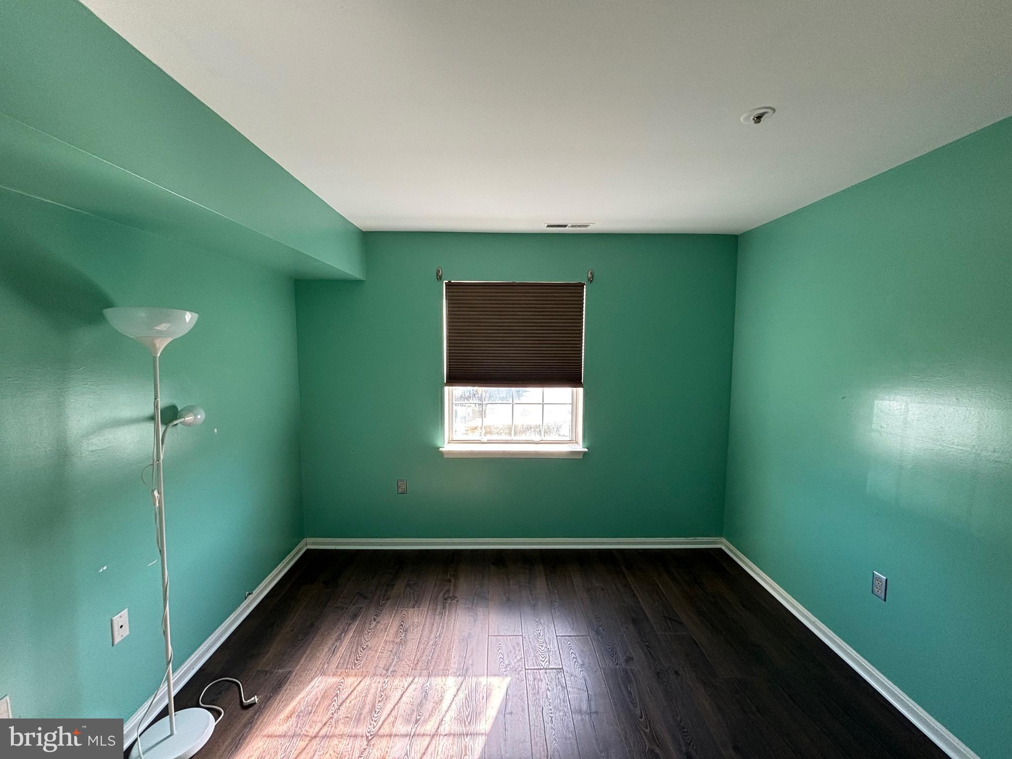 8513 Falls Run Road, Unit A Ellicott City, MD 21043 - Photo 25 of 39 a view of an empty room with window and bathroom