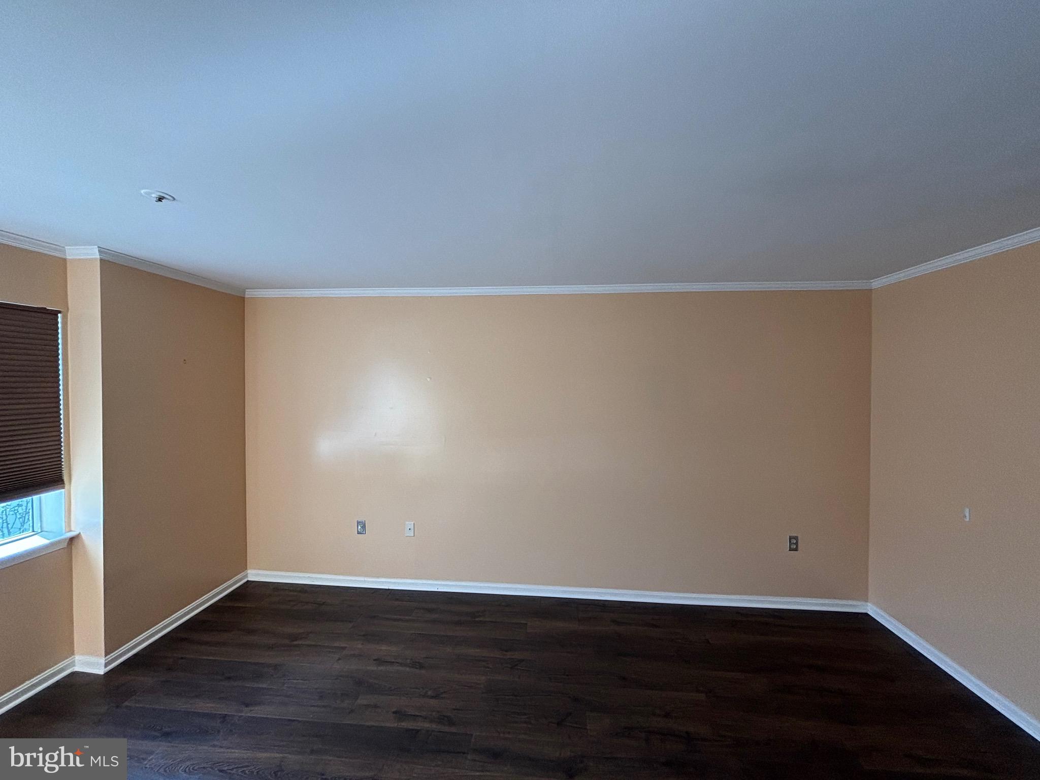 8513 Falls Run Road, Unit A Ellicott City, MD 21043 - Photo 30 of 39 a view of an empty room with wooden floor