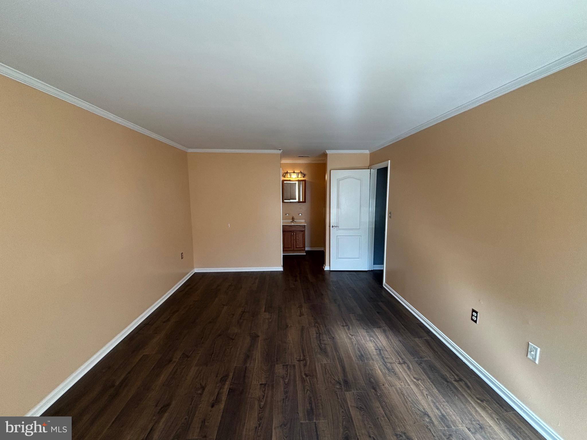 8513 Falls Run Road, Unit A Ellicott City, MD 21043 - Photo 31 of 39 a view of an empty room and wooden floor