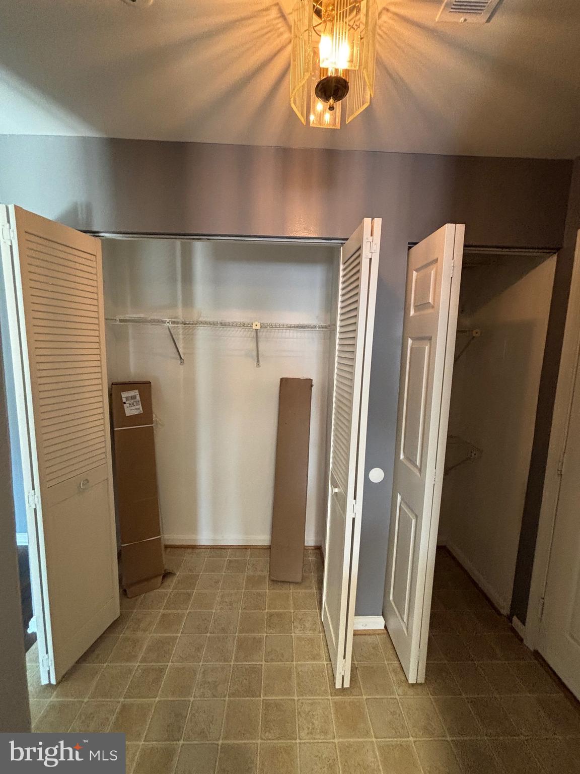 8513 Falls Run Road, Unit A Ellicott City, MD 21043 - Photo 4 of 39 a view of a hallway with wooden walls