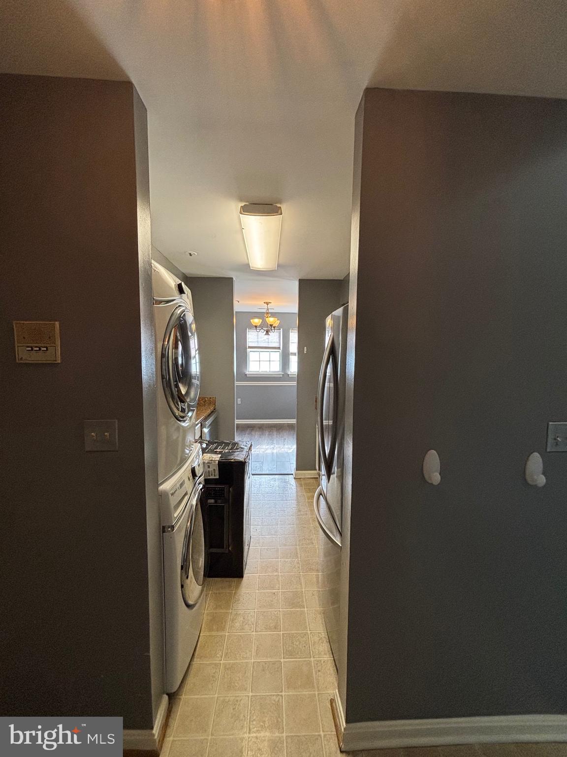 8513 Falls Run Road, Unit A Ellicott City, MD 21043 - Photo 6 of 39 a kitchen with refrigerator and washer