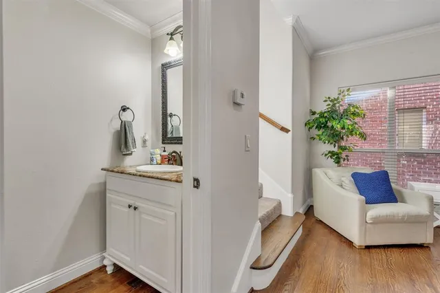 a spacious bathroom with a granite countertop sink and a mirror
