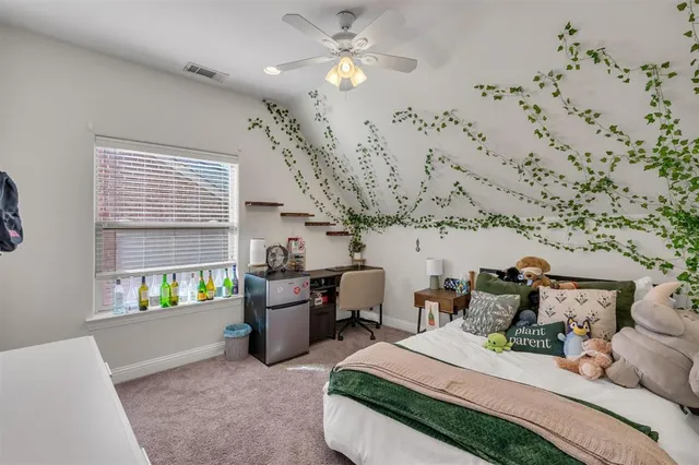 a bedroom with bed and a chandelier