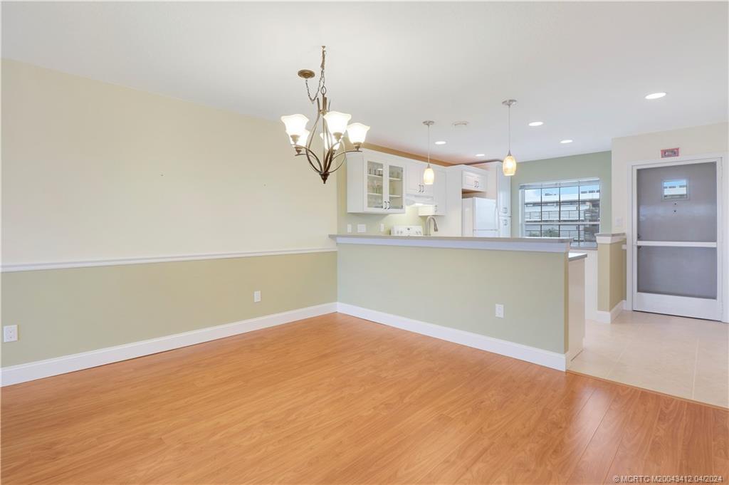 1864 Southwest Palm City Road, Unit 202 Stuart, FL 34994 - Photo 10 of 29 Dining opens to updated kitchen
