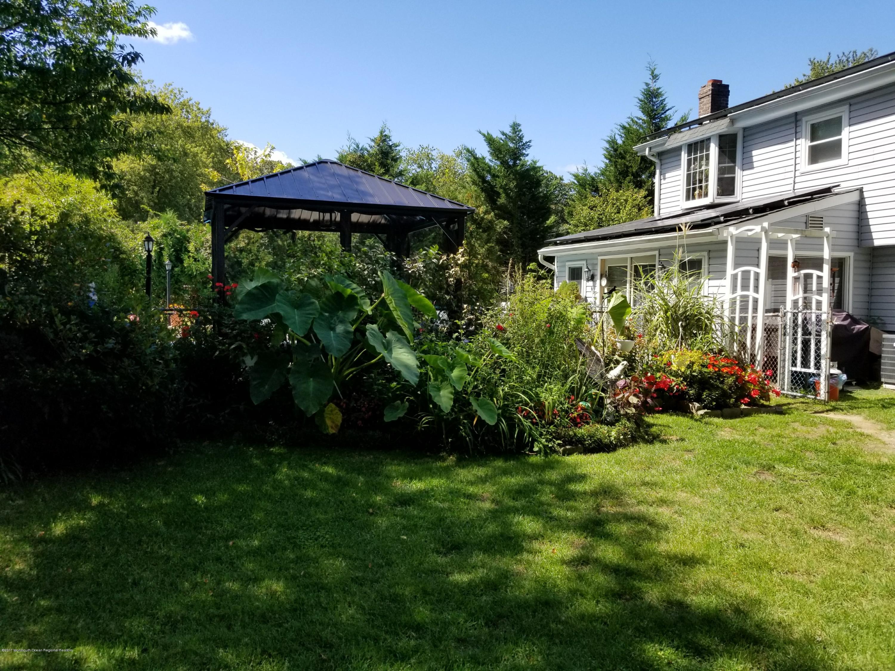 1093 Larsen Road Jackson, NJ 08527 - Photo 28 of 36 a view of a house with a yard and sitting area