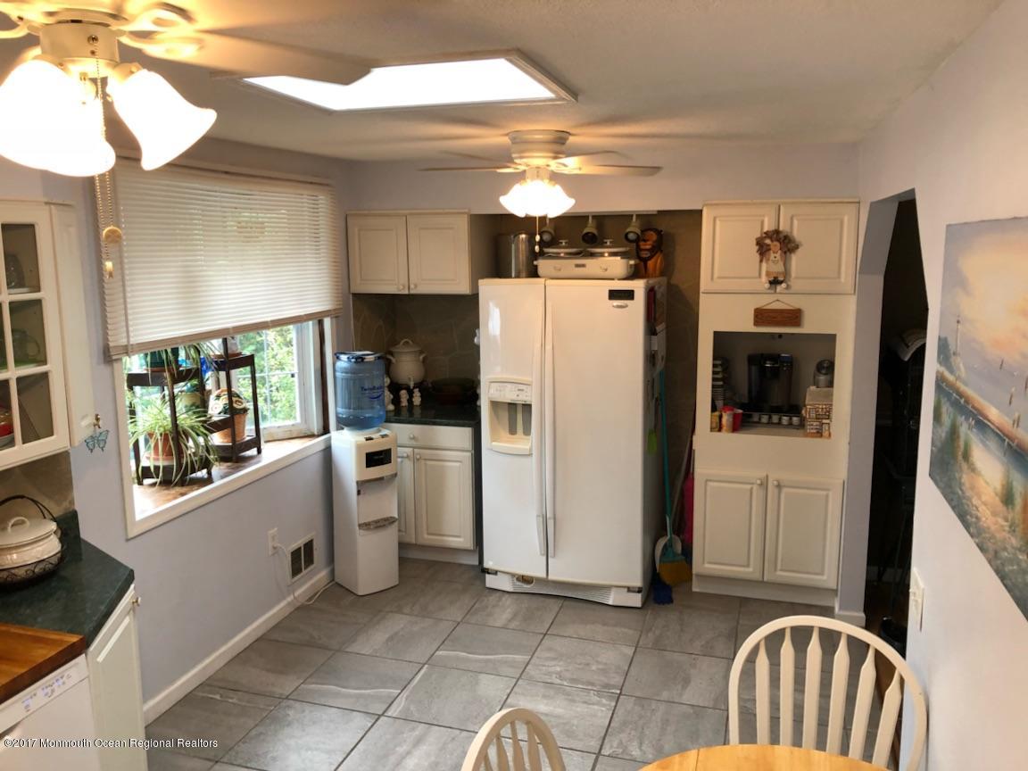 1093 Larsen Road Jackson, NJ 08527 - Photo 9 of 36 a kitchen with a refrigerator and a sink