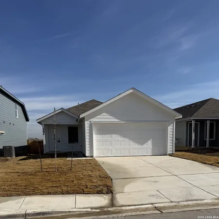 a front view of a house with garage
