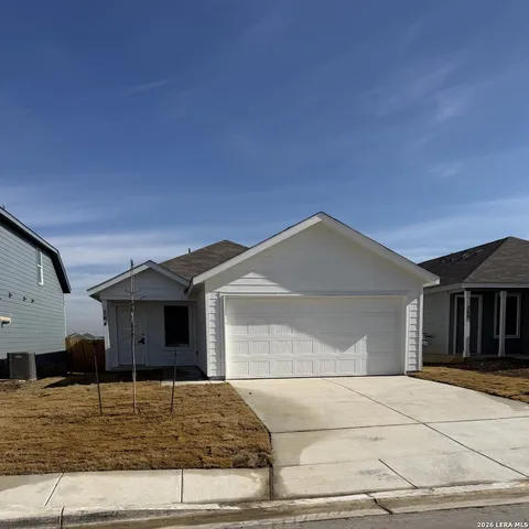 a front view of a house with garage