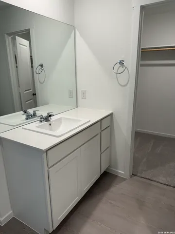 a bathroom with a sink and a mirror
