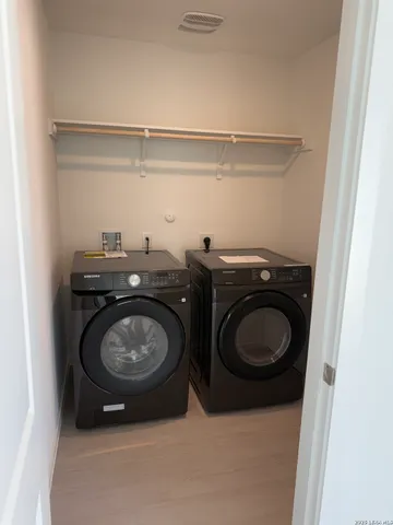 a utility room with a washer and dryer