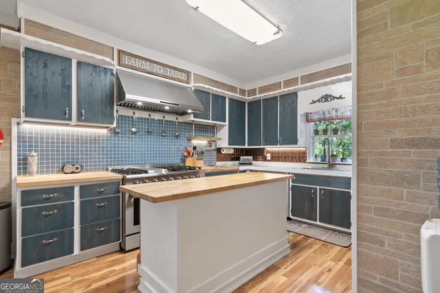 a bedroom with a bed window and dresser