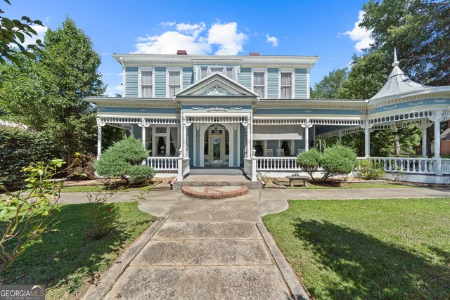 a view of living room and deck with wooden floor
