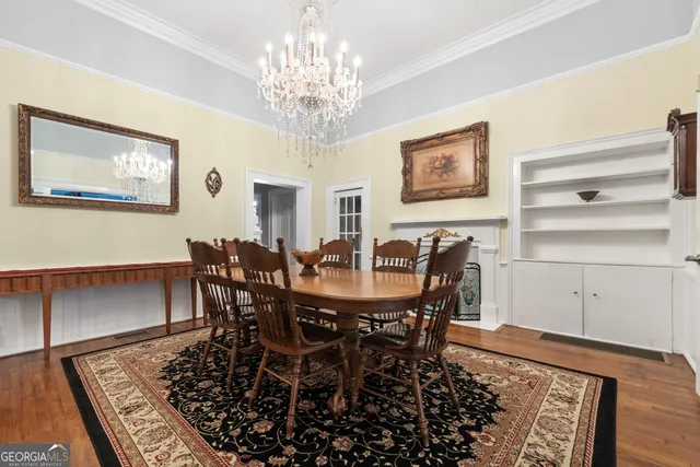 a view of a house with a yard and potted plants