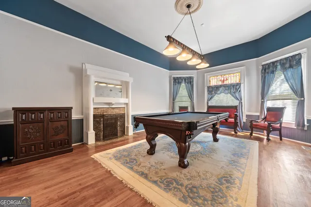 a view of a yard with plants and trees