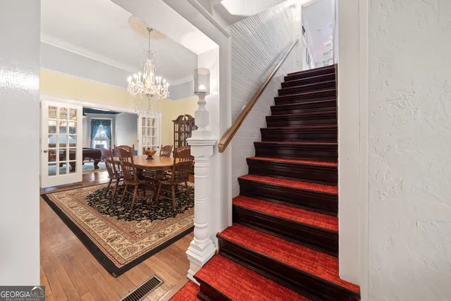 a front view of a house with plants