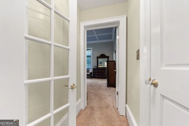 a front view of a house with a garden and deck