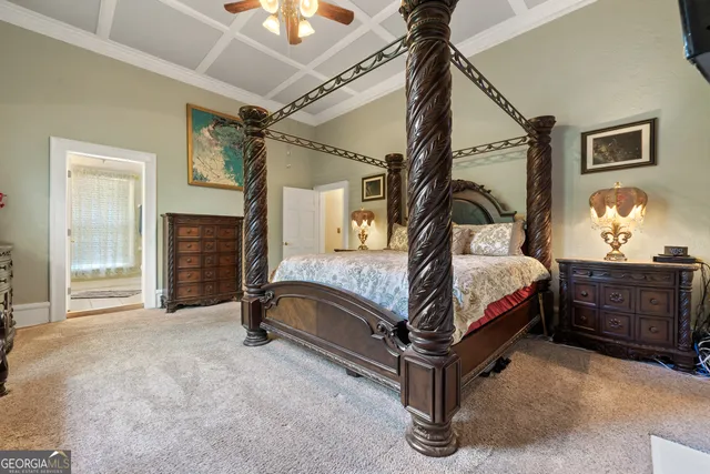 a view of a chair and table in backyard of the house