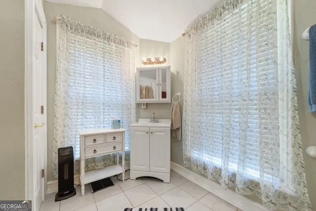 a aerial view of a house with a yard