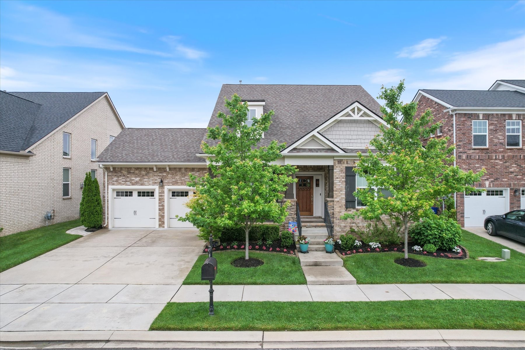 766 Beamon Drive Franklin, TN 37064 - Photo 1 of 39 a front view of a house with a garden and plants