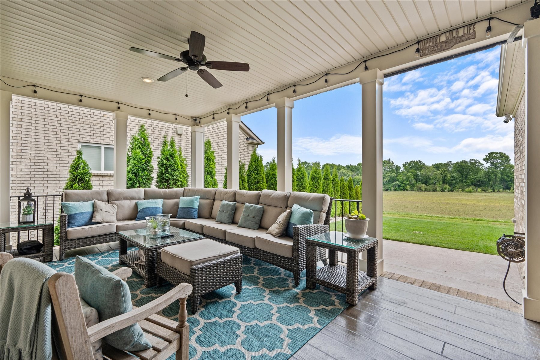 766 Beamon Drive Franklin, TN 37064 - Photo 17 of 39 a living room with patio furniture and a yard