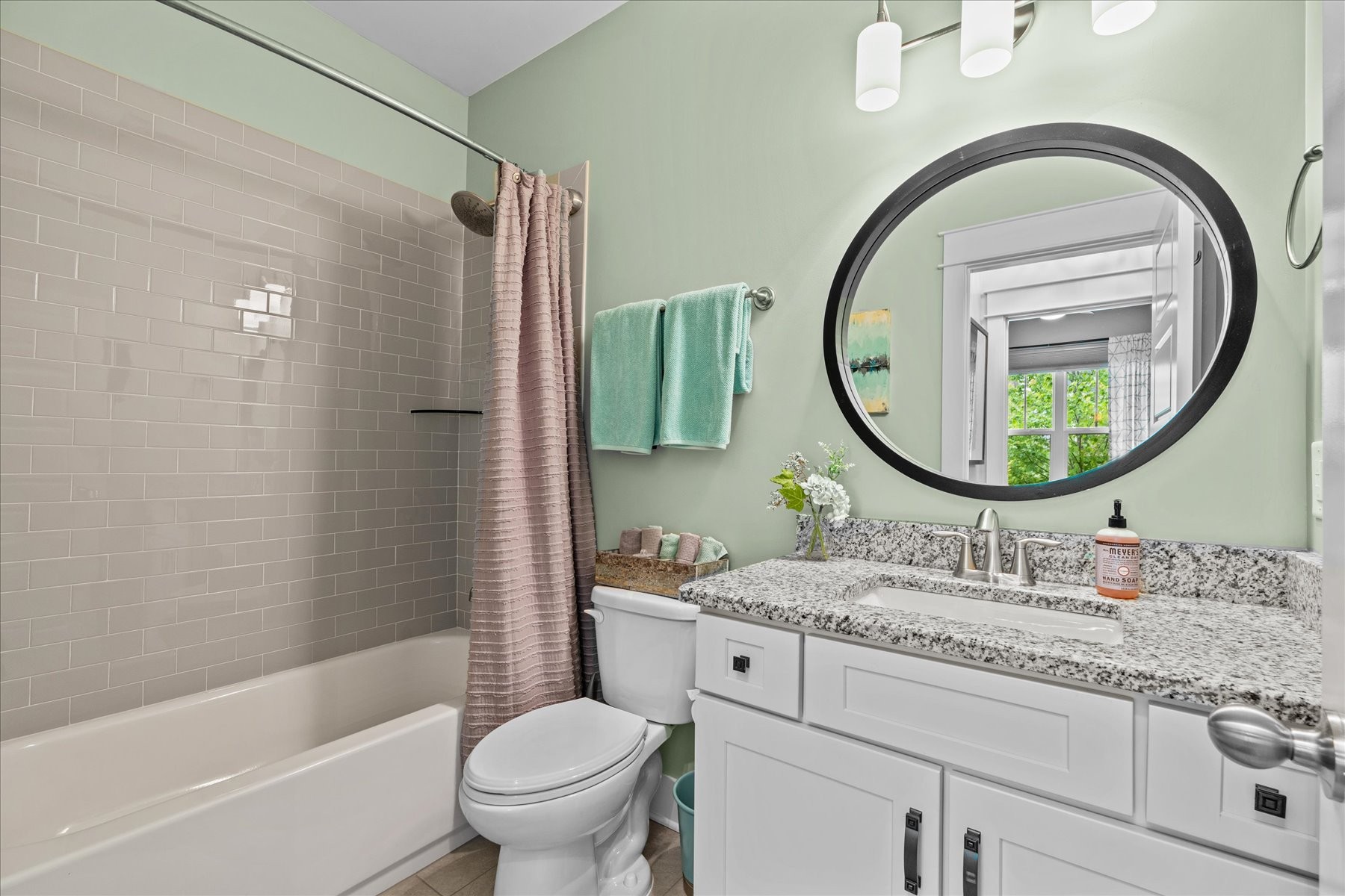 766 Beamon Drive Franklin, TN 37064 - Photo 26 of 39 a bathroom with a granite countertop toilet a sink and a mirror