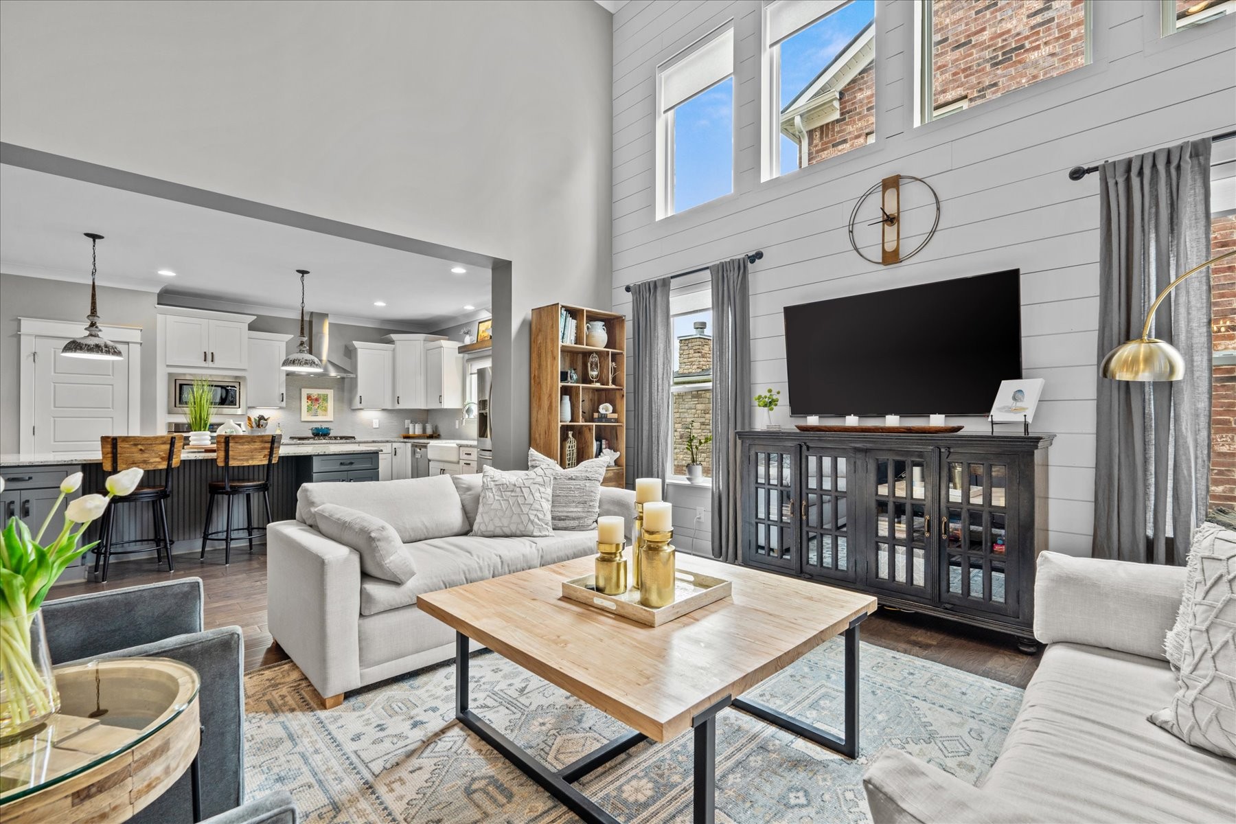 766 Beamon Drive Franklin, TN 37064 - Photo 8 of 39 a living room with furniture a flat screen tv and a clock