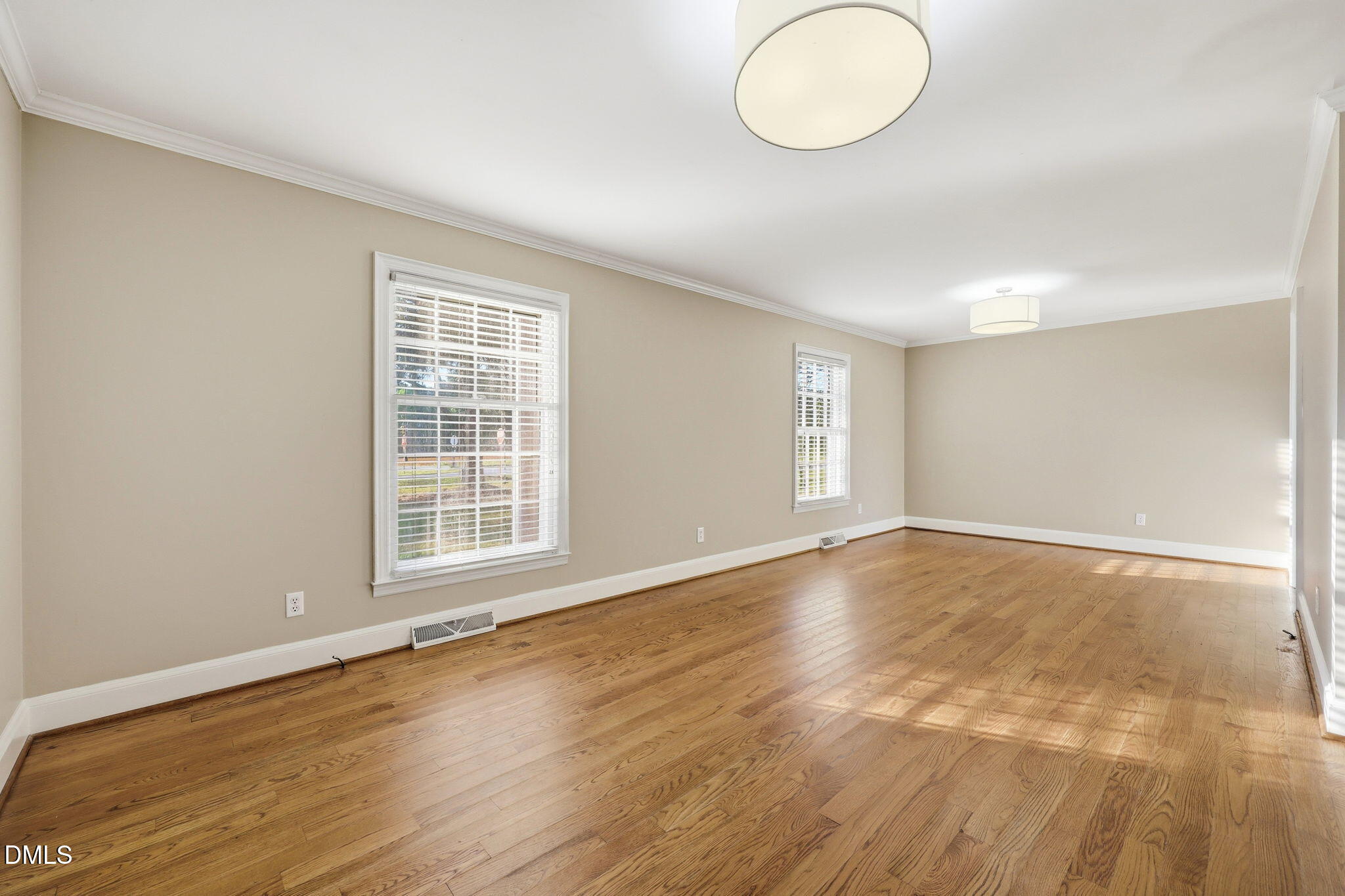 1130 Prospect Church Road Dunn, NC 28334 - Photo 24 of 47 an empty room with wooden floor and windows