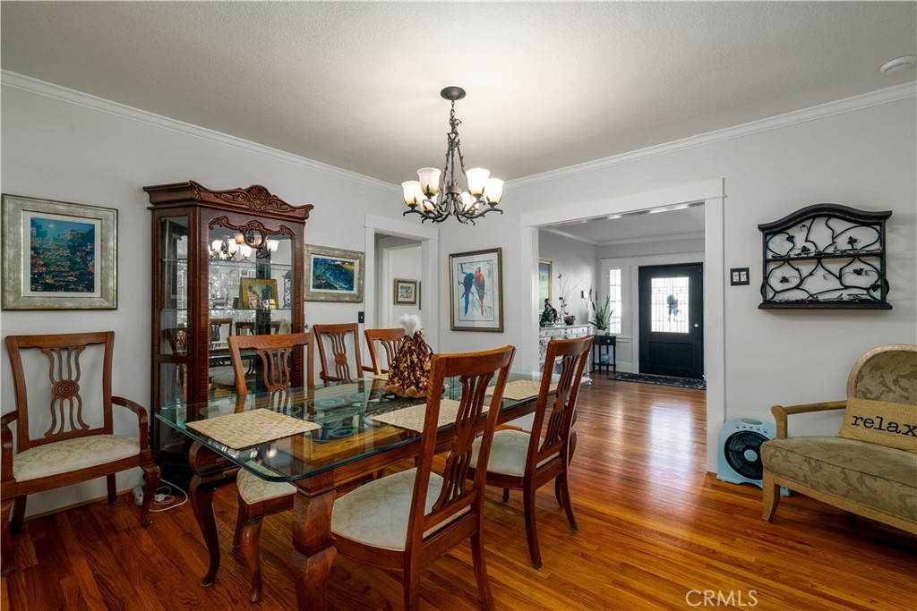 3642 Larchwood Place Riverside, CA 92506 - Photo 12 of 35 a view of a dining room with furniture and wooden floor