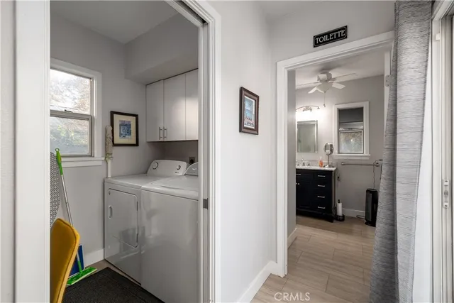 a view of hallway with washer and dryer