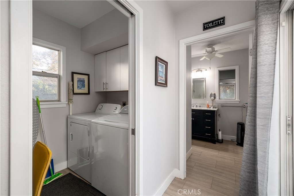 3642 Larchwood Place Riverside, CA 92506 - Photo 24 of 35 a view of hallway with washer and dryer