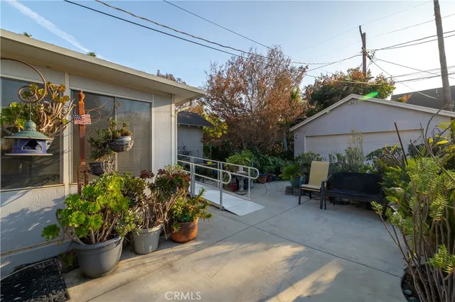 a view of a backyard with sitting area and furniture
